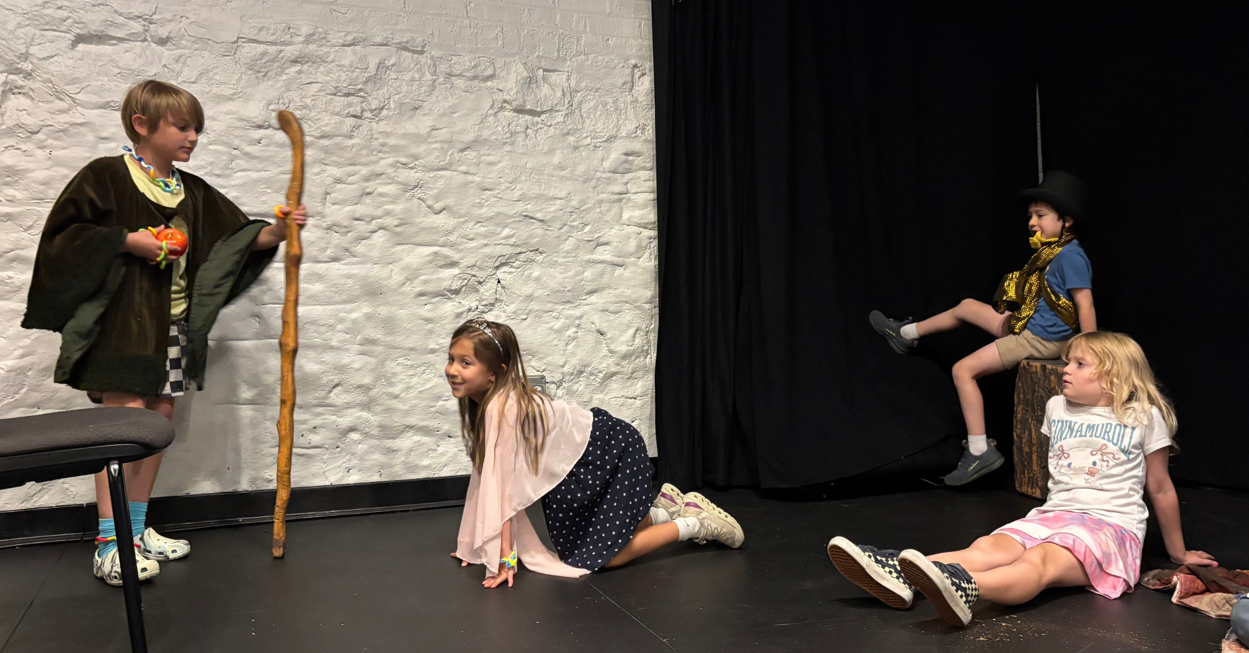 Kids performing an original play during Lookingglass Theatre's summer camp.